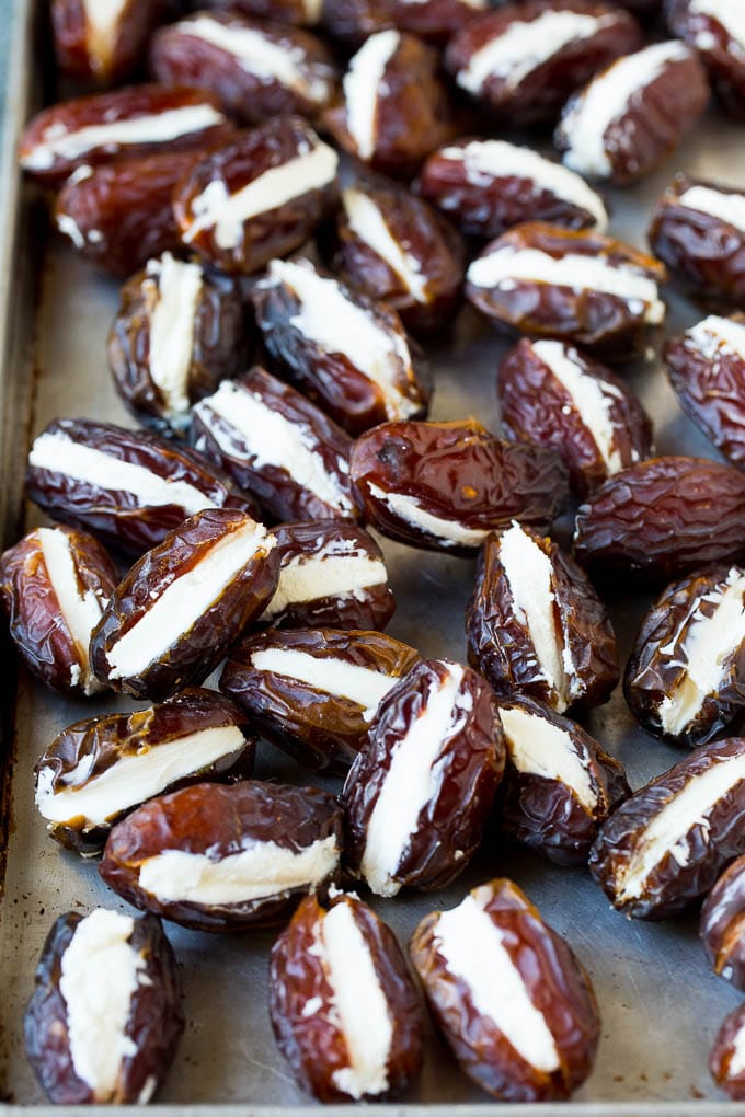Bacon Wrapped Dates #appetizer #bacon #dates #cheese #sadud Dates cut in half and filled with goat cheese.