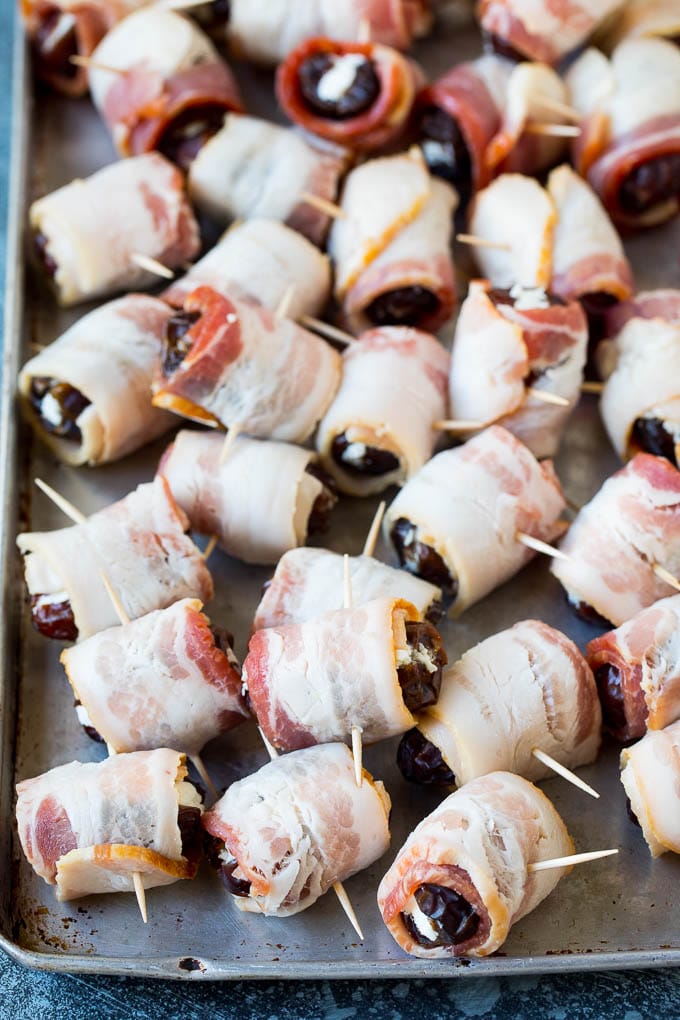 Bacon Wrapped Dates #appetizer #bacon #dates #cheese #sadud Dates wrapped in bacon and secured with toothpicks.
