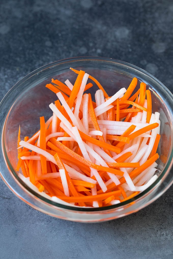 Bahn Mi Sandwich Recipe #sandwich #pork #lunch #dinner #sadud Shredded carrots and daikon radish in a bowl.