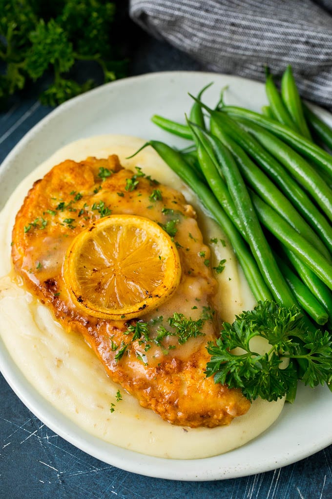 Chicken Francese Recipe #chicken #lemon #dinner #sadud Chicken francese served over mashed potatoes with green beans.