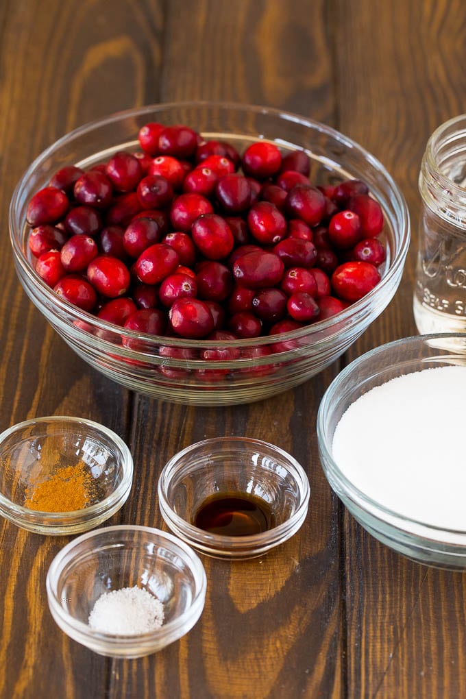 This homemade cranberry sauce is a 6 ingredient recipe that's made with fresh cranberries, sugar and a hint of spice. Bowls of cranberries, sugar and seasonings.