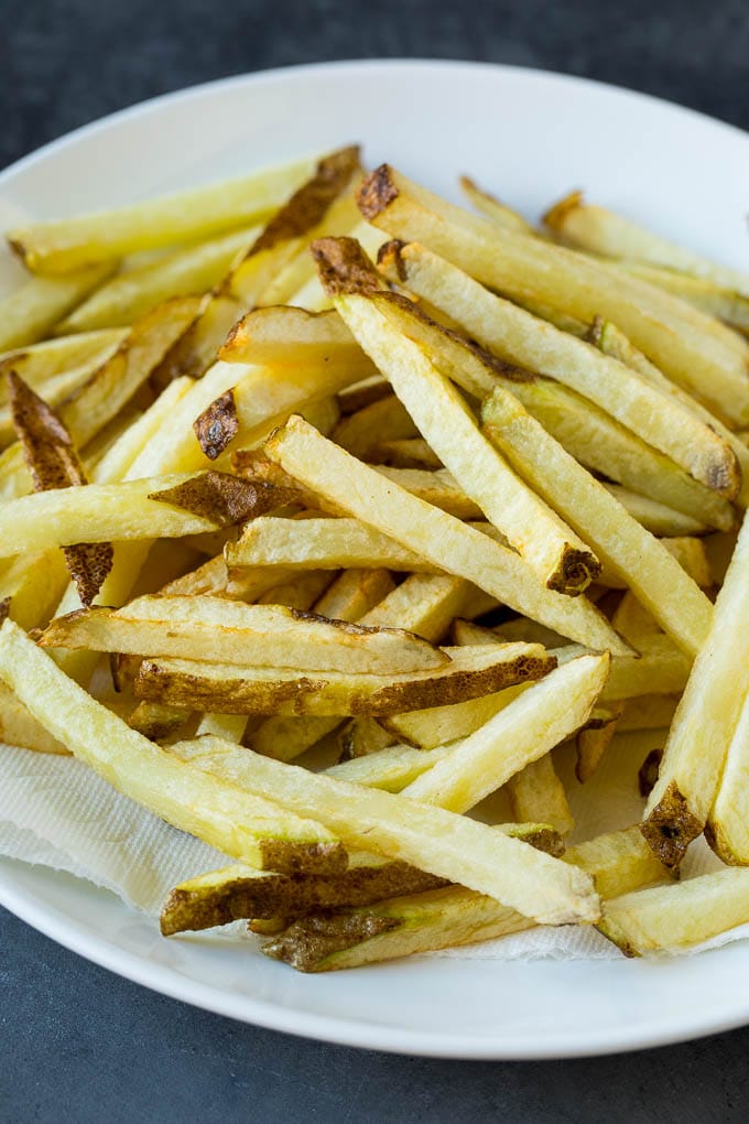 Homemade French Fries Recipe #potatoes #fries #dinner #sadud Par-fried potatoes on a plate.
