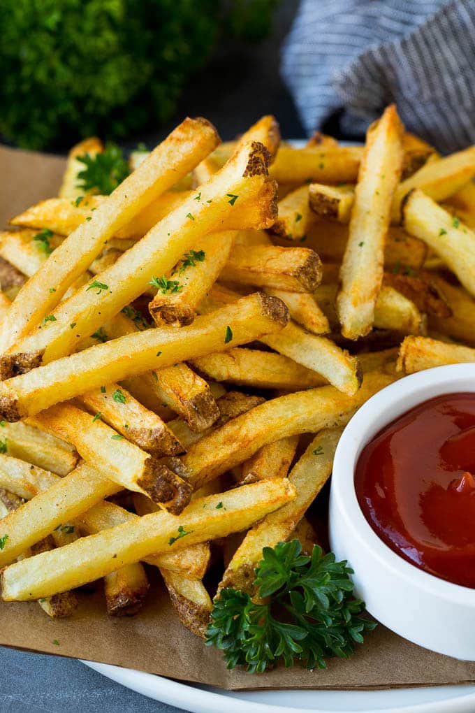 Homemade French Fries Recipe #potatoes #fries #dinner #sadud A plate of homemade french fries served with a bowl of ketchup.