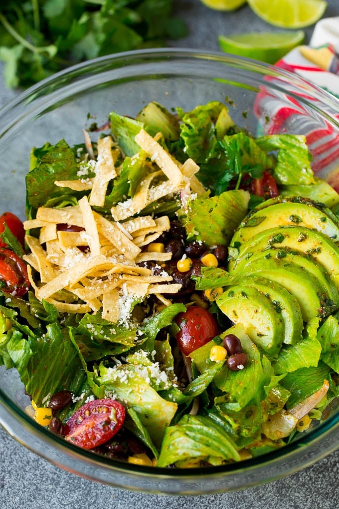 Mexican Salad Recipe #salad #corn #beans #avocado #tomatoes #sadud Mexican salad with lettuce, corn, beans and tomato, tossed in a lime dressing.