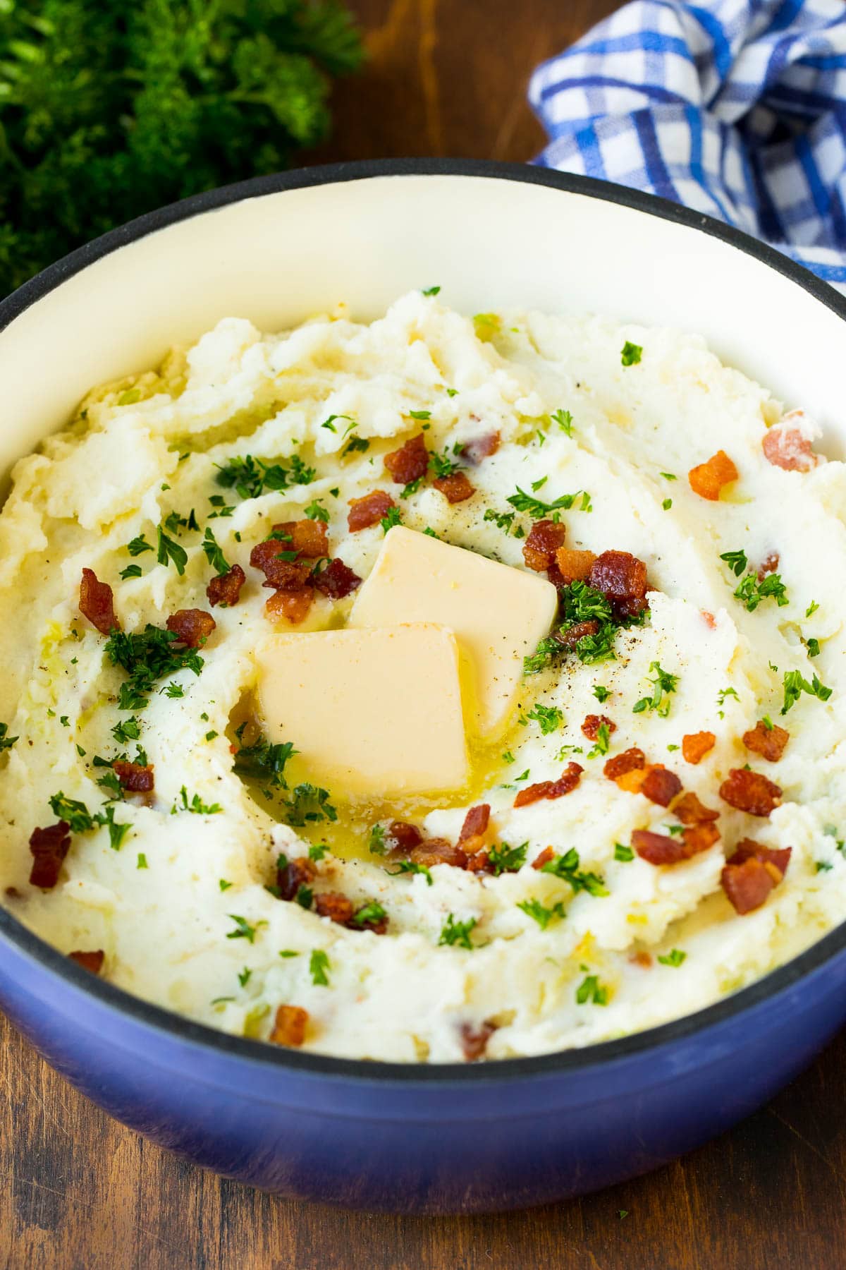 Colcannon Recipe | Mashed Potatoes #potatoes #cabbage #bacon #sidedish #stpatricksday #dinner #sadud A pot of colcannon garnished with butter, bacon and herbs.