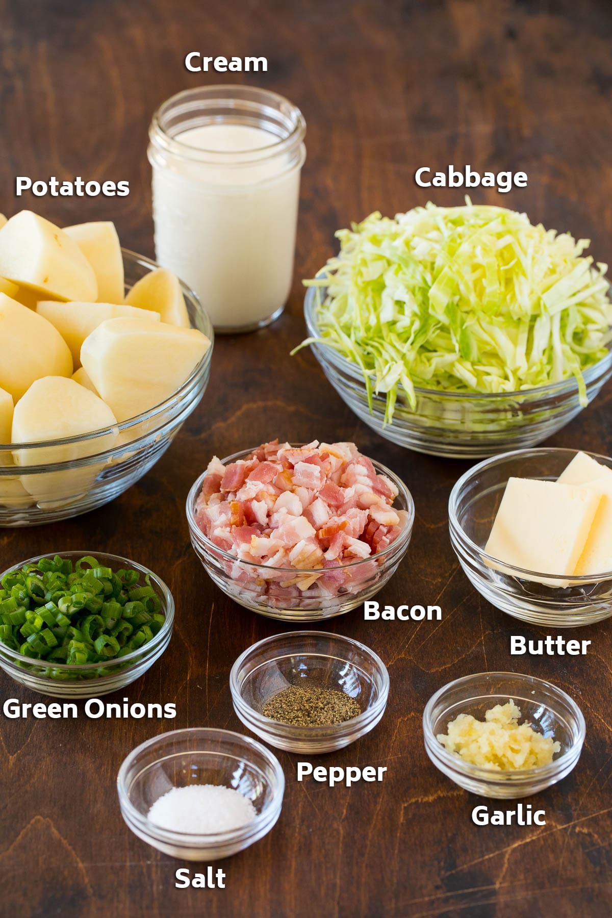 Colcannon Recipe | Mashed Potatoes #potatoes #cabbage #bacon #sidedish #stpatricksday #dinner #sadud Bowls of bacon, cabbage, potatoes, and seasonings.