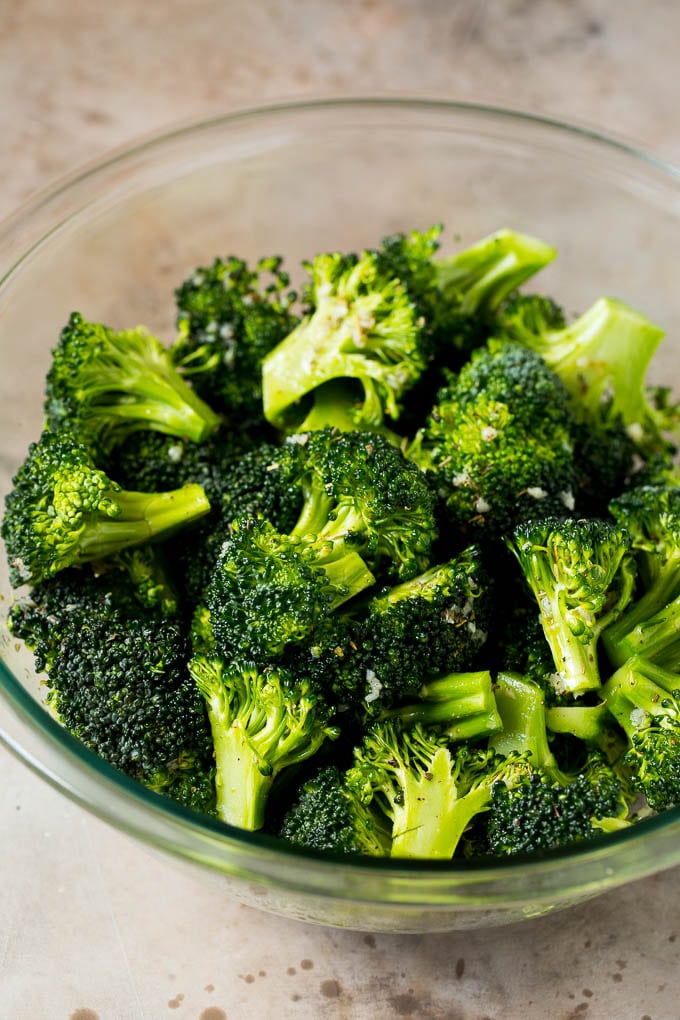 Grilled broccoli is packed with flavor and is a colorful and healthy side dish! #broccoli #sadud Florets tossed with olive oil, garlic and herbs.