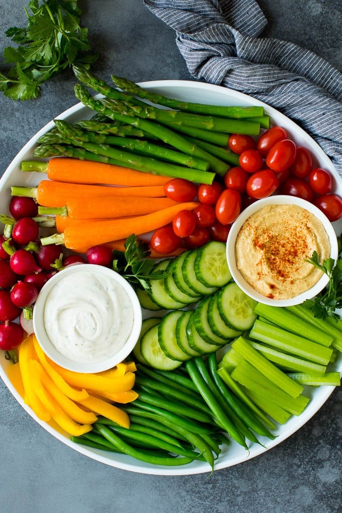 This homemade veggie tray is an assortment of colorful vegetables paired with a variety of flavorful dips. A large veggie tray with assorted fresh and steamed vegetables, ranch dip and hummus.