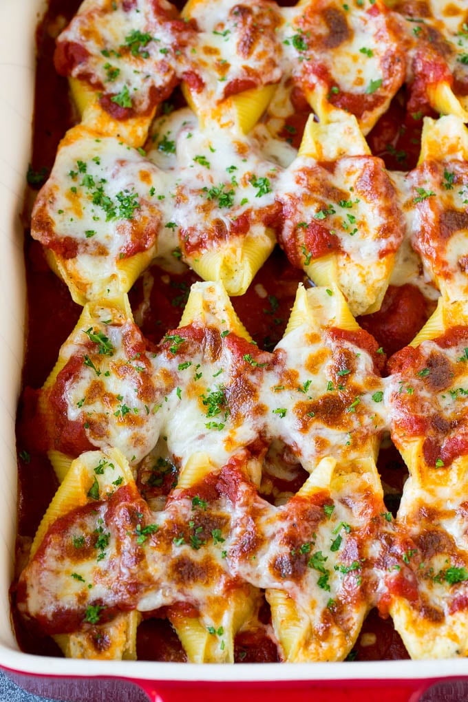 Baked stuffed shells filled with three types of cheese and topped with marinara sauce. #pasta #sadud Baked stuffed shells filled with three types of cheese and topped with marinara sauce.
