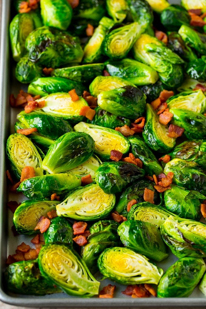 Balsamic brussels sprouts are roasted with bacon, then topped with a drizzle of balsamic glaze. Roasted brussels sprouts and bacon.