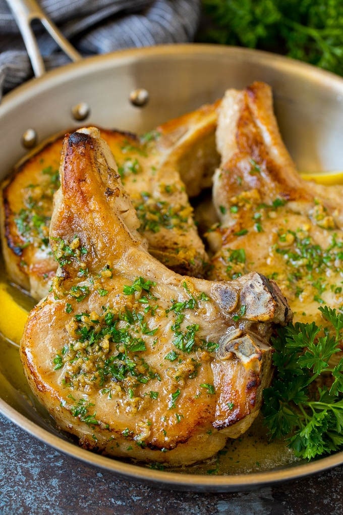 This pork chop brine is a blend of salt, sugar, herbs and spices that infuses the meat with flavor and helps to keep it tender and juicy. Cooked brined pork chops.