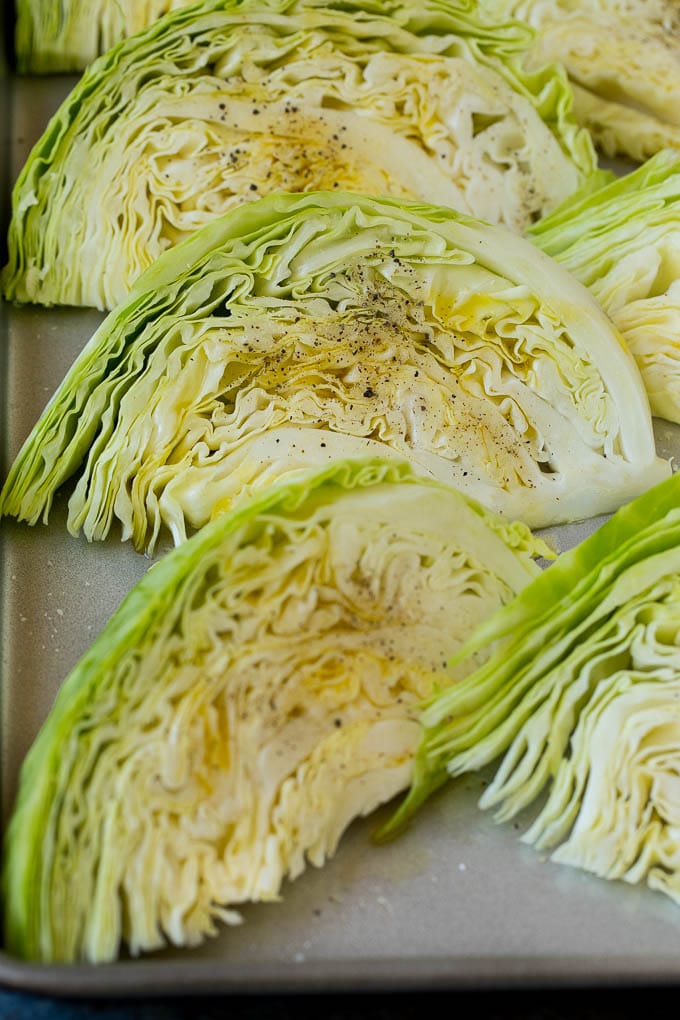This roasted cabbage recipe is wedges of cabbage seasoned with olive oil and spices, then oven baked until tender and browned. Cabbage seasoned with olive oil and spices.