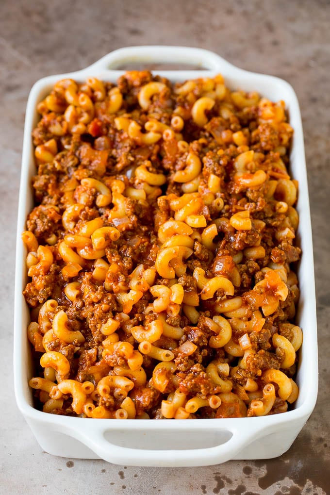This cheeseburger casserole is ground beef, bacon, macaroni and plenty of cheese, all baked together to perfection. Beef and sauce tossed with macaroni in a baking dish.