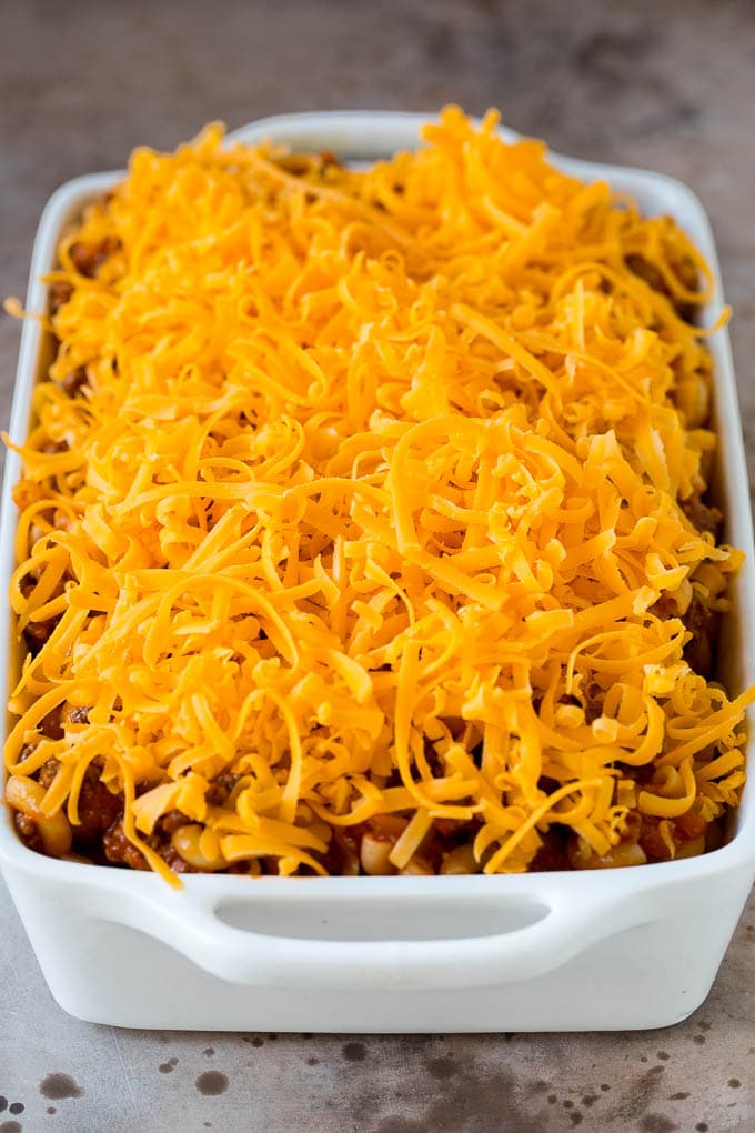 This cheeseburger casserole is ground beef, bacon, macaroni and plenty of cheese, all baked together to perfection. A casserole dish of pasta and beef topped with shredded cheese.