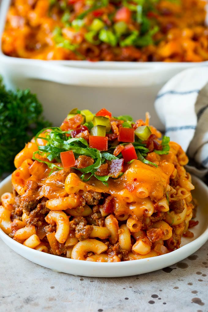 This cheeseburger casserole is ground beef, bacon, macaroni and plenty of cheese, all baked together to perfection. A serving of cheeseburger casserole on a plate.
