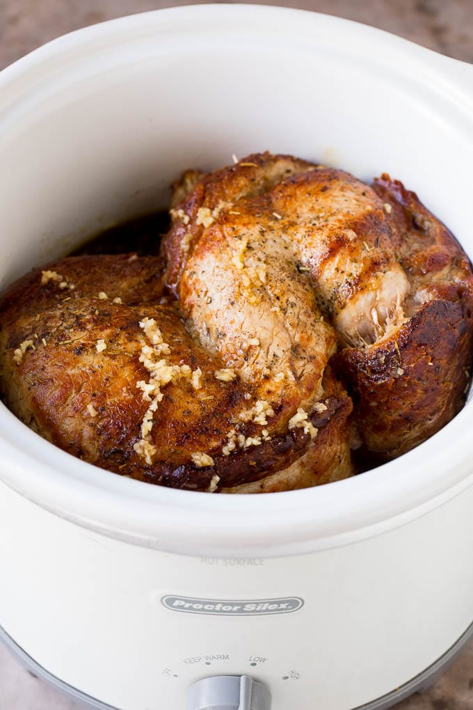 This crock pot pork roast is tender pork loin simmered in a slow cooker in a rich and flavorful gravy. Pork in a slow cooker coated in sauce.
