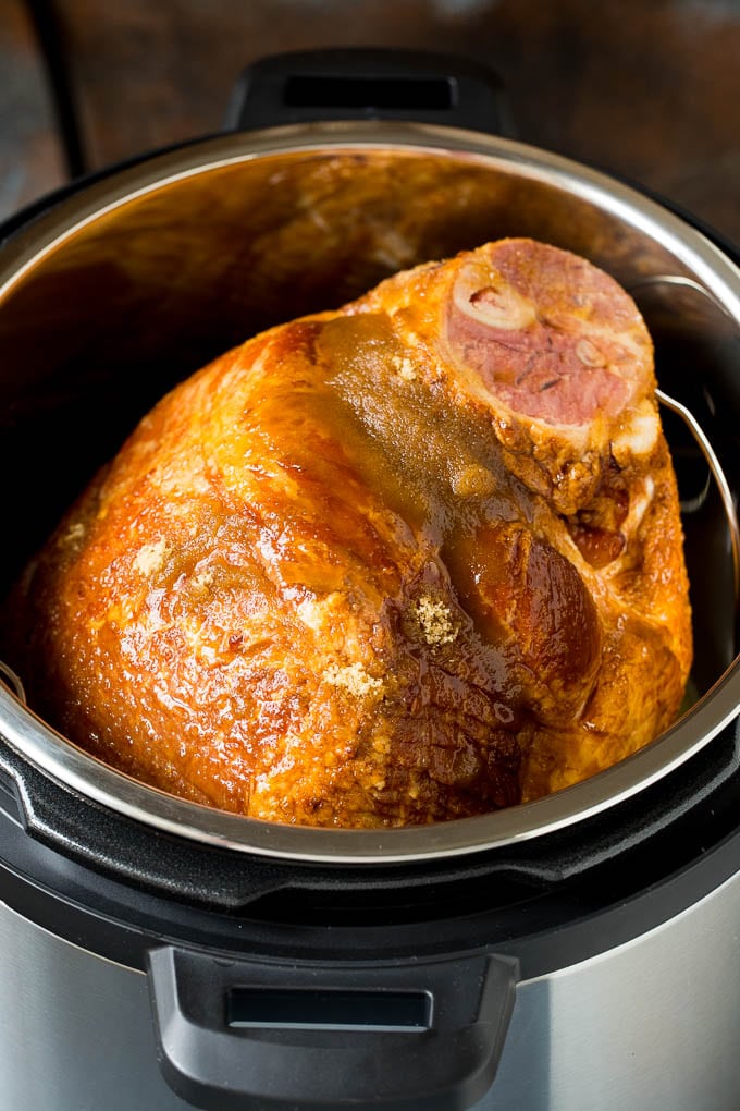 This Instant Pot ham is a spiral ham coated in a 3 ingredient glaze, then pressure cooked to tender perfection. A ham coated in brown sugar and maple syrup in an Instant Pot.