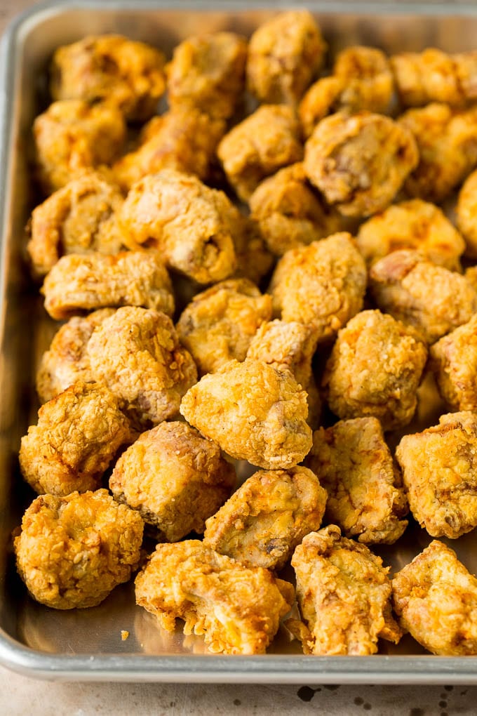 This sweet and sour pork is chunks of pork tenderloin that are breaded and fried, then tossed with pineapple and fresh vegetables in a homemade sauce. Breaded and fried pork pieces.