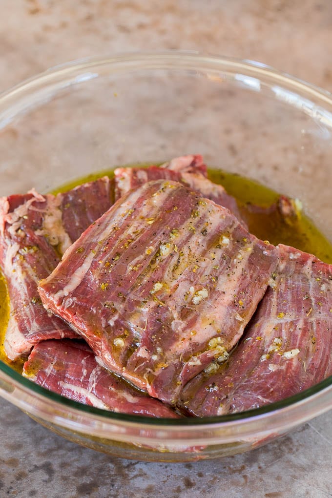 This churrasco recipe is marinated skirt steak that is grilled to tender perfection, then topped with a fresh and flavorful chimichurri sauce. Skirt steak in an olive oil and citrus marinade.
