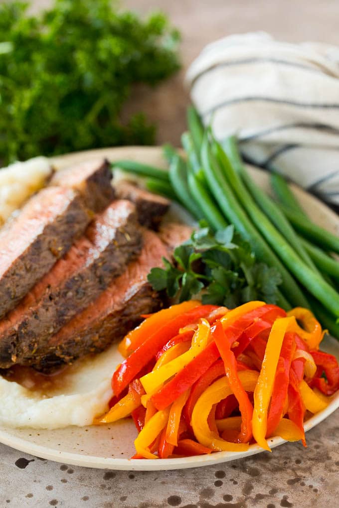 Peperonata served with steak and green beans.