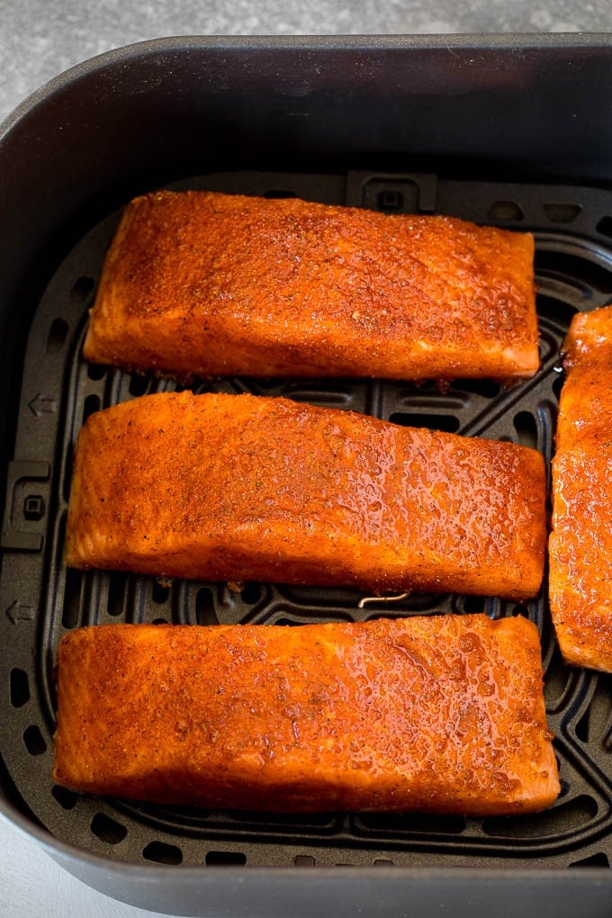 This air fryer salmon is fresh fish fillets topped with a homemade spice rub, then cooked to golden brown perfection. Spice crusted salmon fillets in an air fryer.