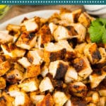This copycat Chipotle chicken recipe is chicken thighs marinated in a blend of chilies, garlic and herbs, then cooked to tender and golden brown perfection.