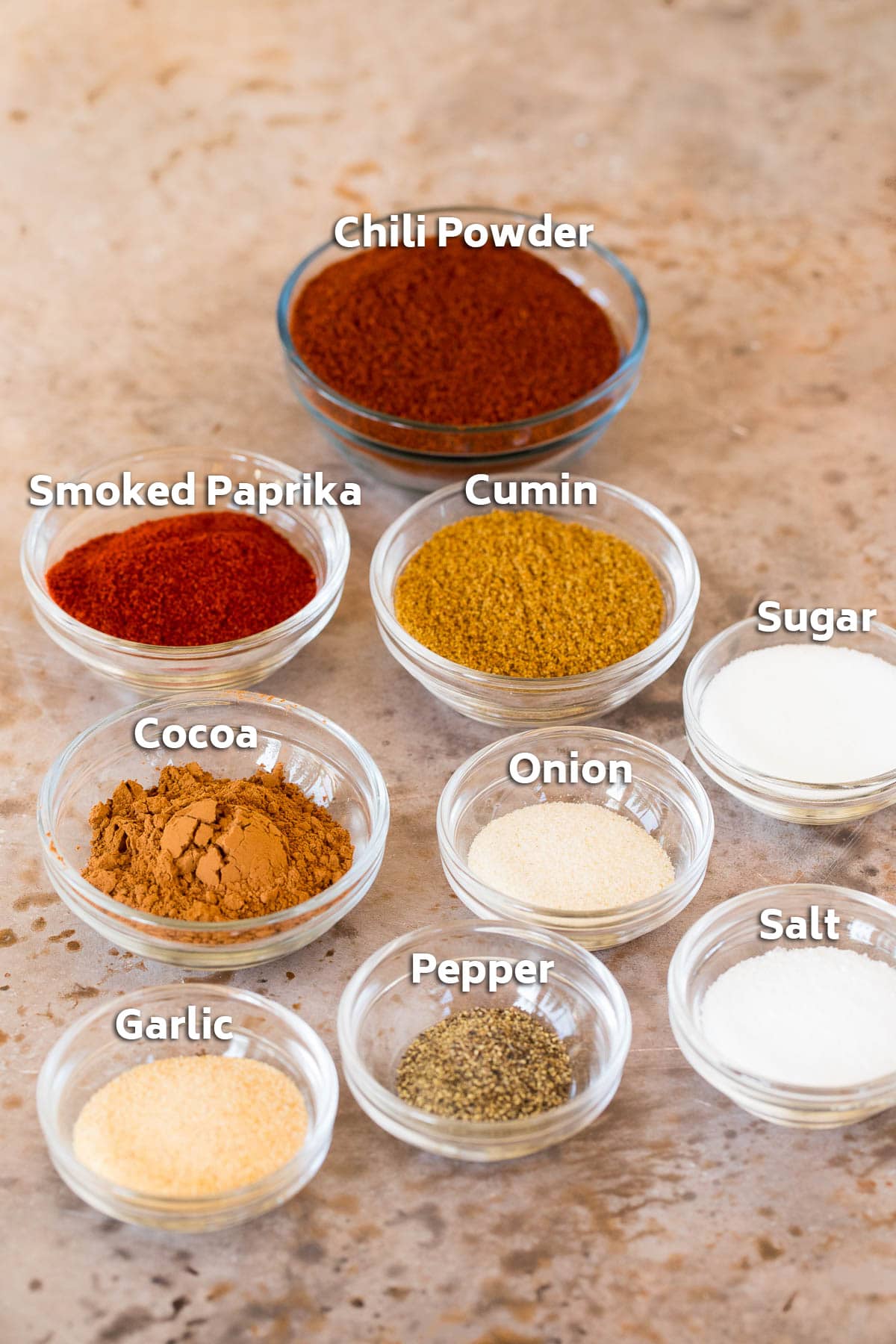 Glass bowls of different types of spices.