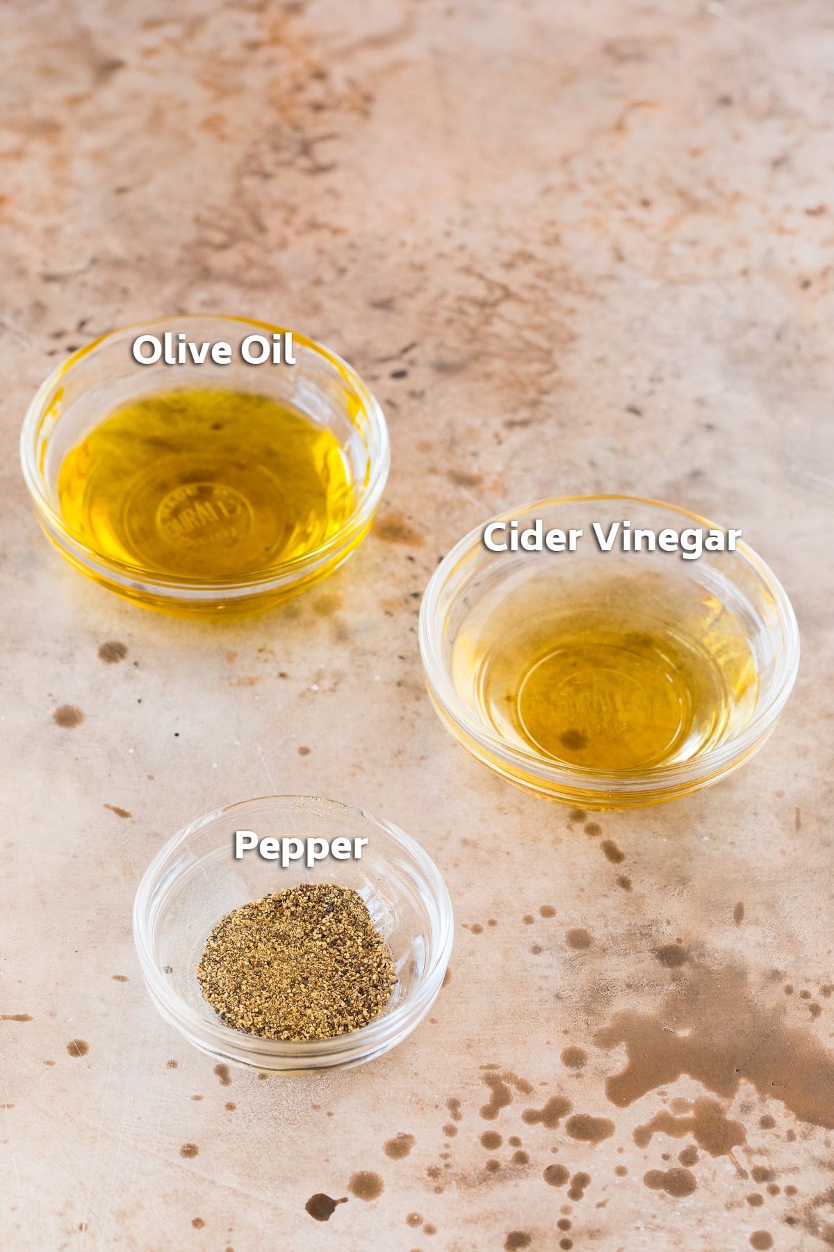 Bowls containing salad dressing ingredients.