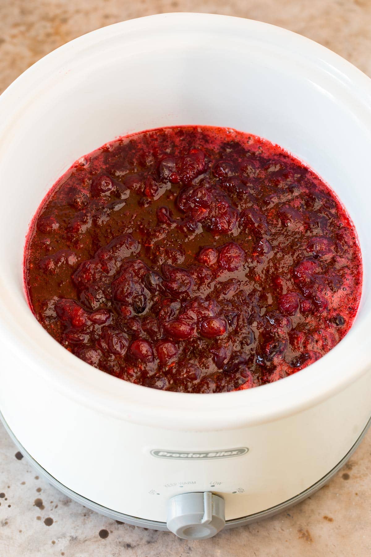 Condiment cooked and ready to serve inside a crock pot.