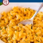 This recipe for slow cooker mac and cheese is a blend of tender pasta with two types of cheese and plenty of seasonings, all cooked together to creamy and cheesy perfection.