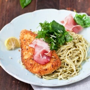 An image of chicken Bellagio on a bed of noodles.