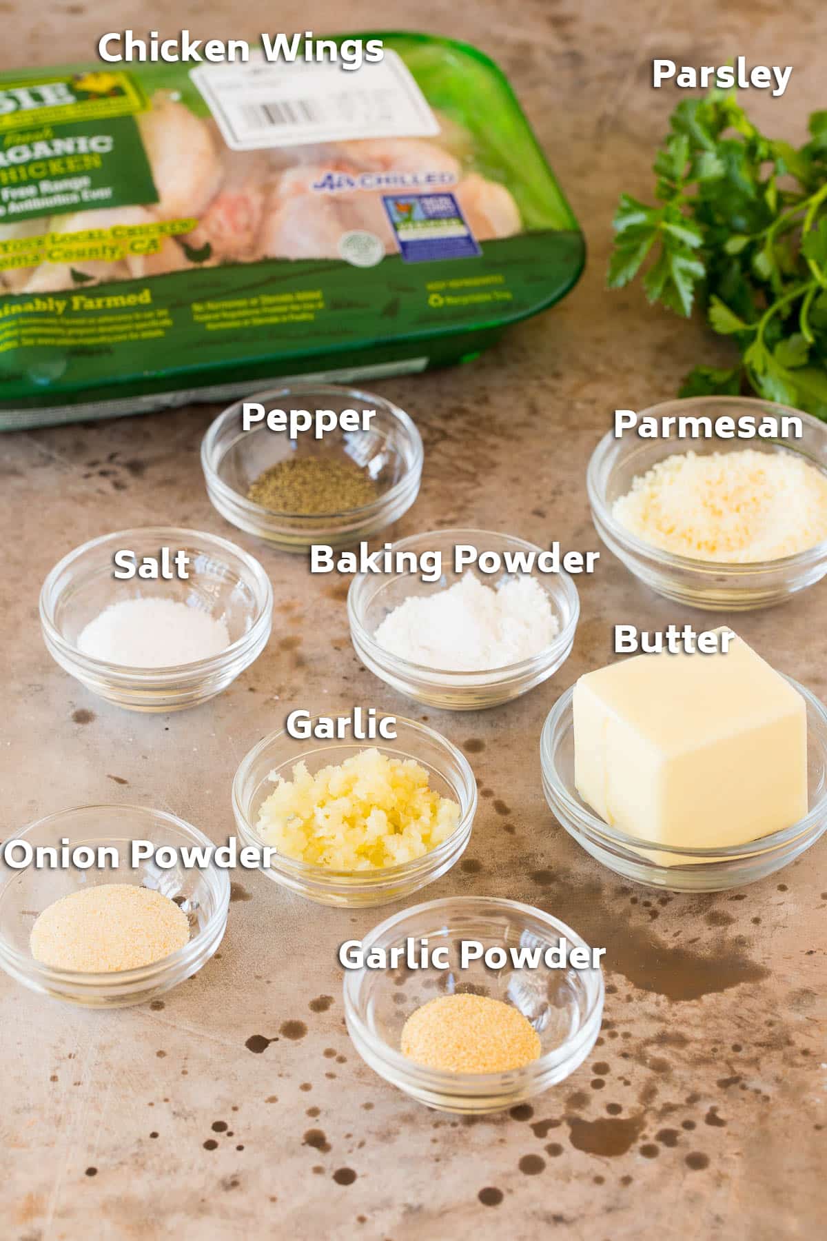 Ingredients including chicken, butter, seasonings and cheese.