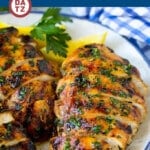 A plate of grilled chicken breast which is chicken soaked in a flavorful garlic and herb marinade, then grilled to perfection.