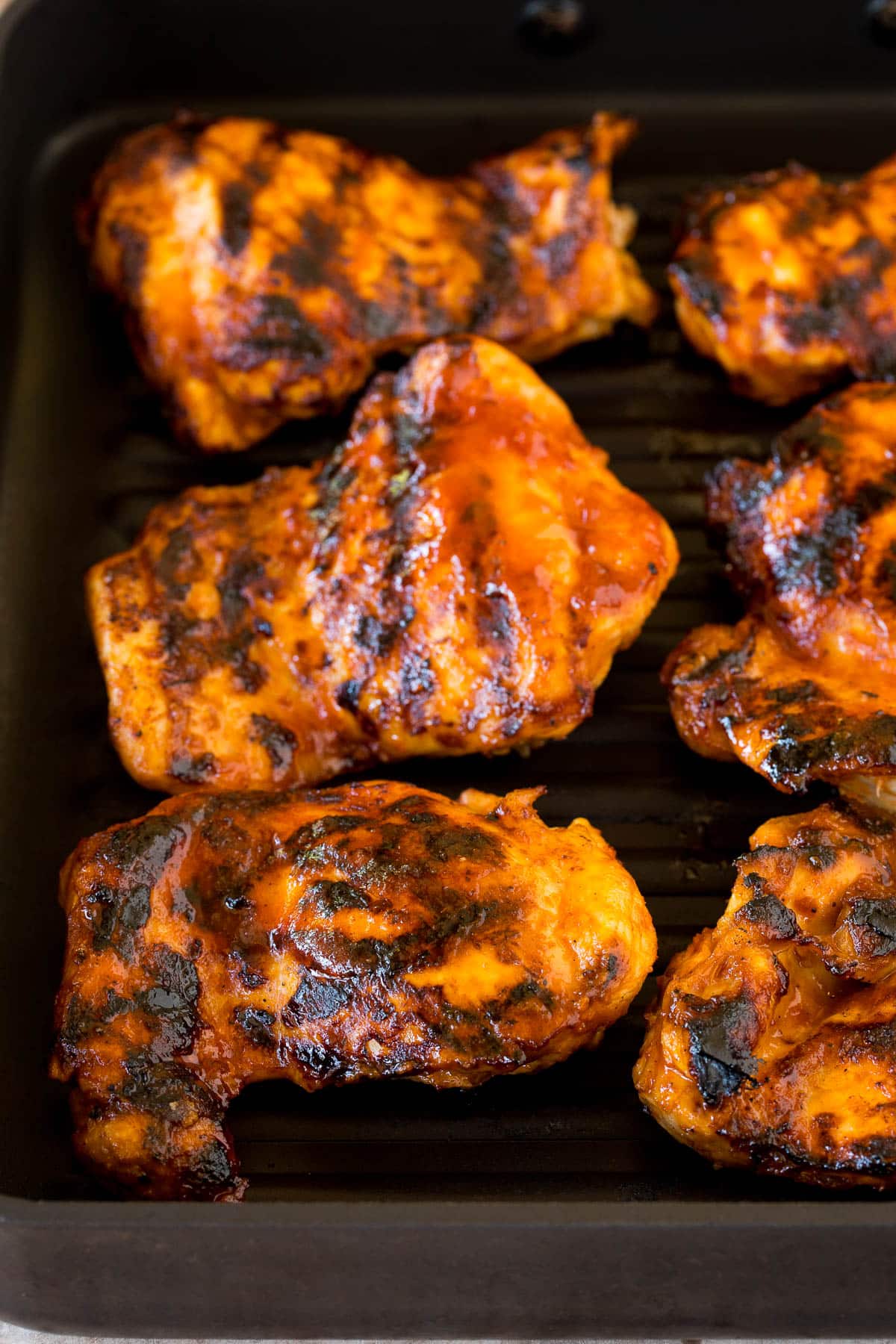 Chicken cooked on a grill pan.