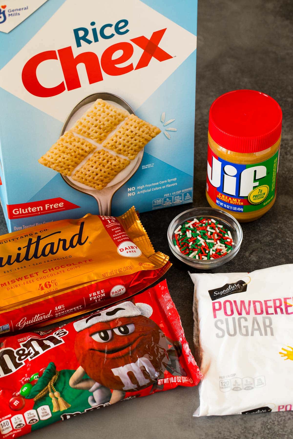 Ingredients including Chex cereal, chocolate chips, peanut butter and powdered sugar.