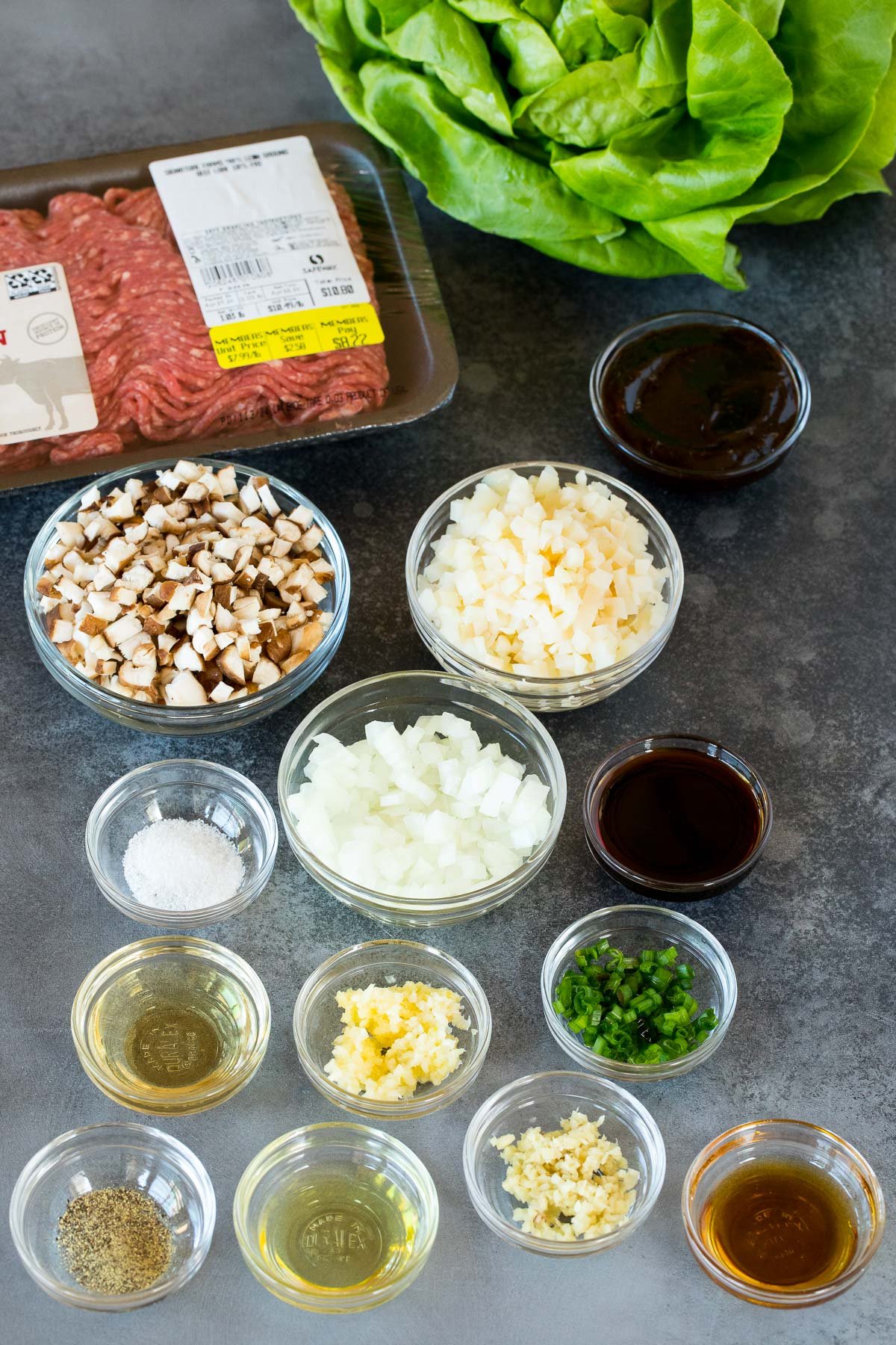 Ingredients including ground beef, vegetables, seasonings and sauces.