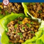 These beef lettuce wraps contain ground beef and plenty of veggies, cooked in a savory sauce and served in crisp butter lettuce leaves.