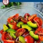 A bowl of tomato avocado salad in a refreshing lime dressing.