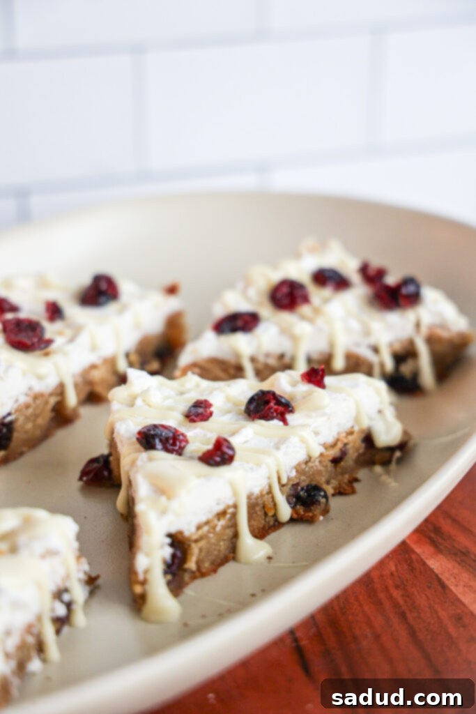 Starbucks-Worthy Cranberry Bliss Bars At Home 3 a plate of vegan and gluten-free cranberry bliss bars.