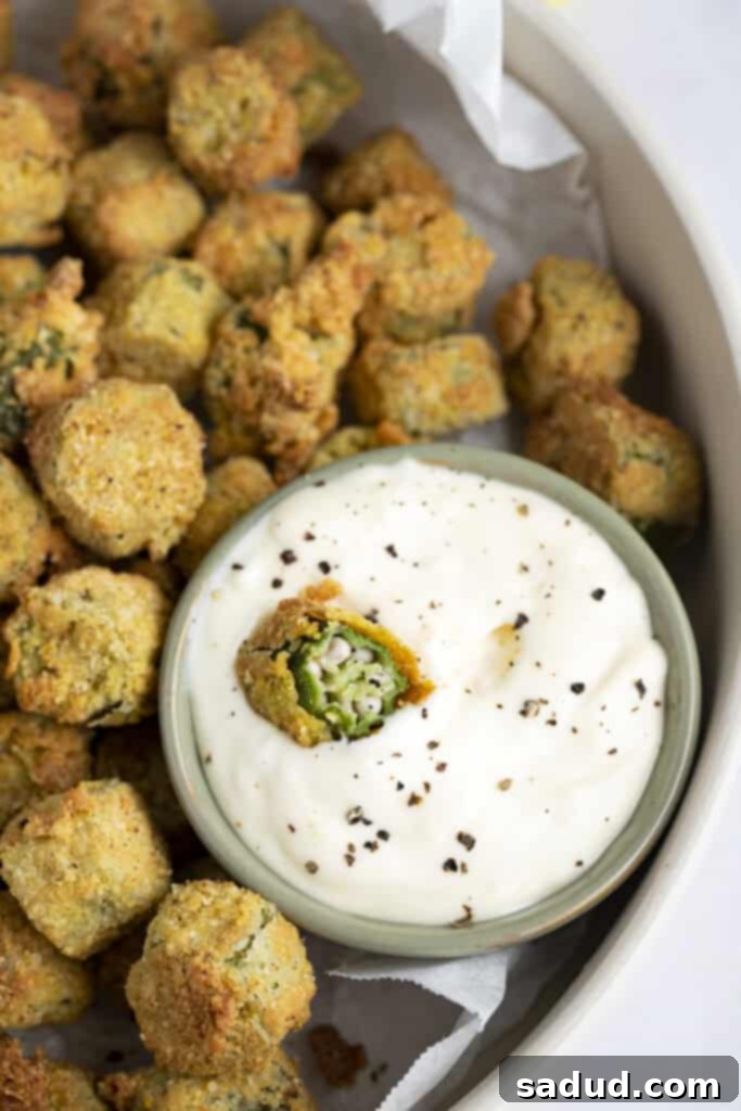 Air fryer okra in a bowl of lemon garlic aioli