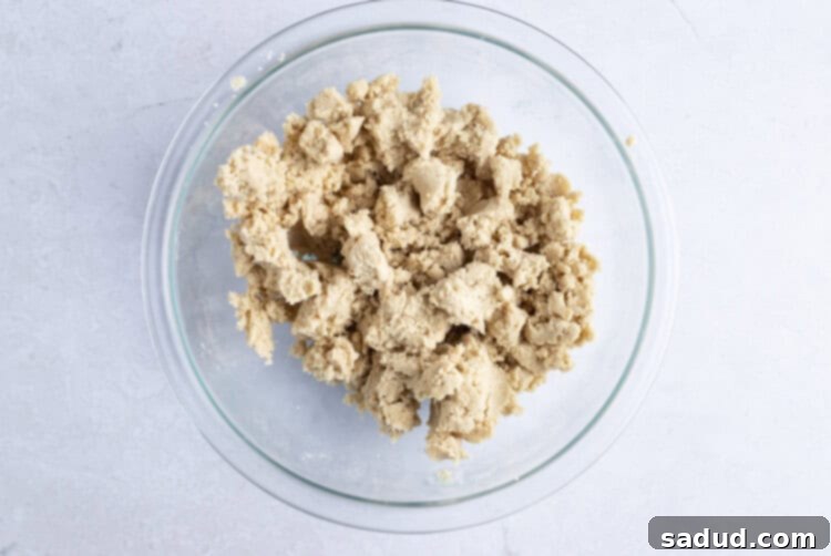 Streusel topping mixture for vegan coffee cake in large glass bowl