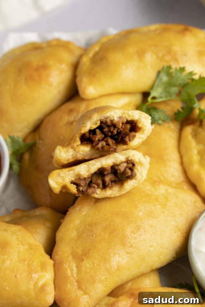 keto empanadas, torn open to show filling