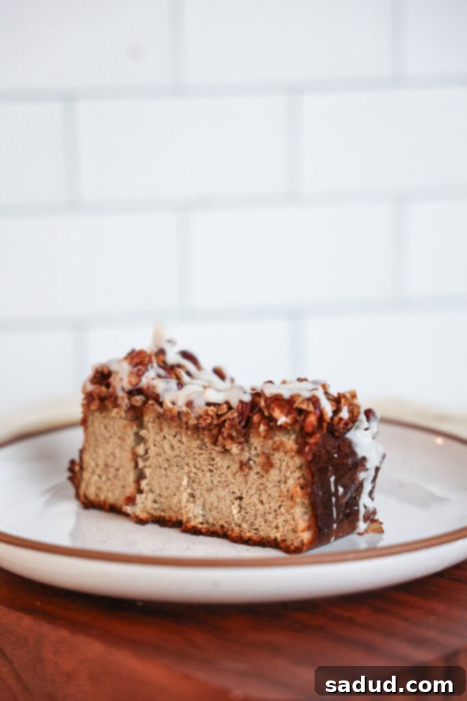 Two slices of protein banana bread, one with streusel topping and glaze, another plain.