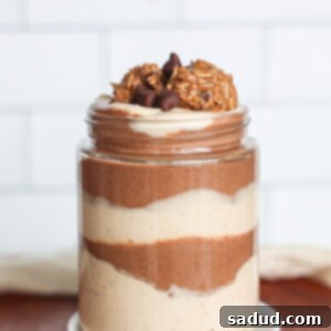 Chocolate Chia Mousse with peanut butter layer, topped with coconut whipped cream and chocolate shavings.