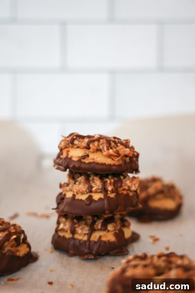 Healthy homemade vegan samoa girl scout cookies stacked on a plate.