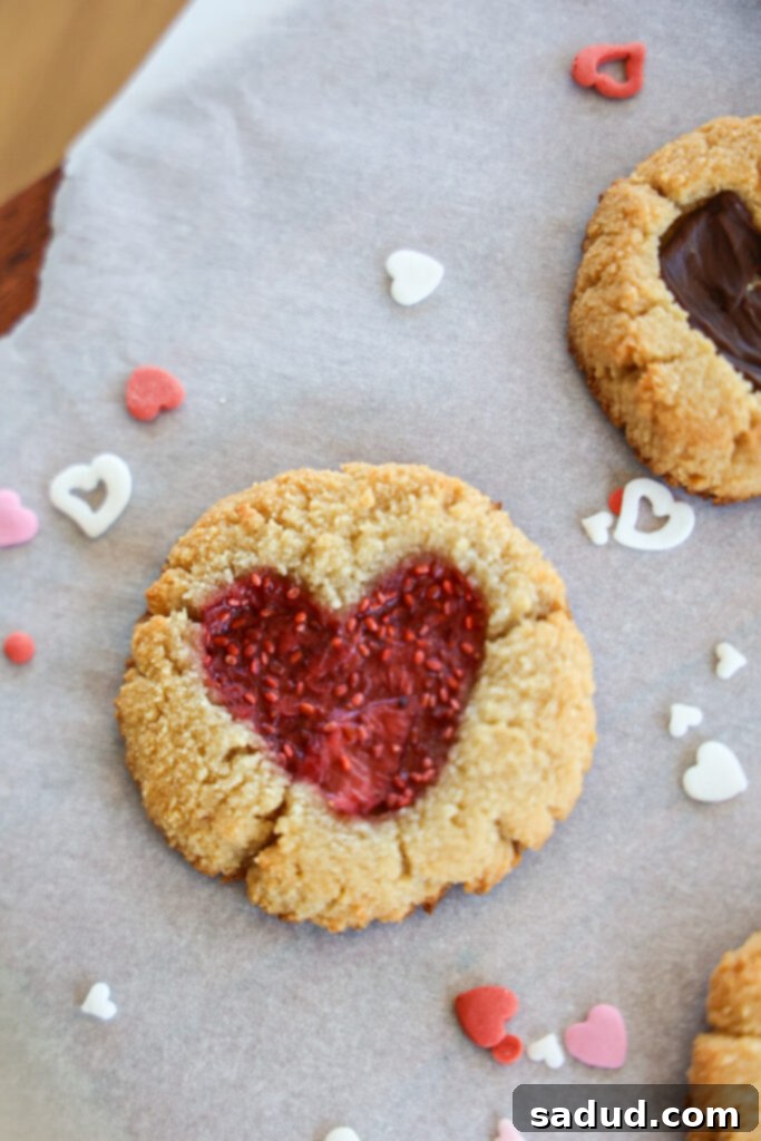 Valentines Day Heart cookies - Close-up of cookie dough balls with heart indents, ready for filling
