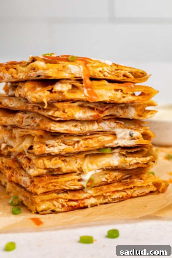 buffalo chicken quesadillas slices stacked on top of each other