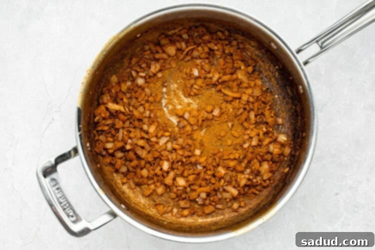 beef vindaloo step 4 - spices added to the caramelized onions and garlic