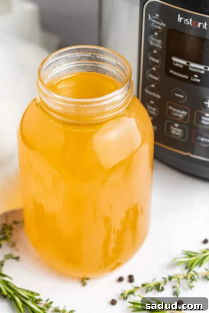 instant pot turkey stock in a jar in front of the instant pot