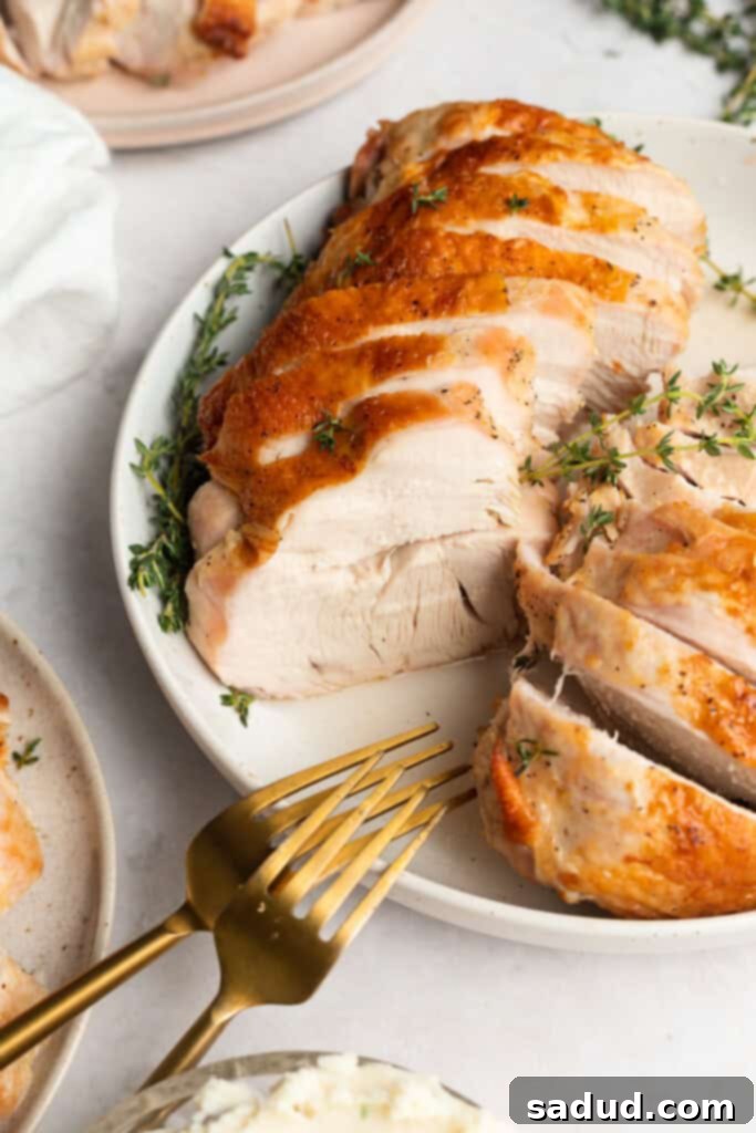 turkey breast sliced and served on three separate plates with serving utensils